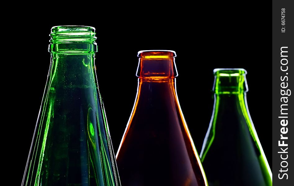 Close-up empty bottles isolated on black