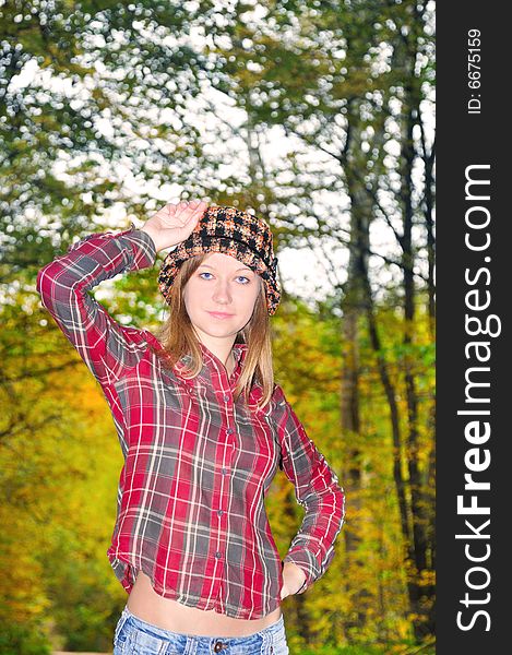 Portrait of the nice girl on autumn park background