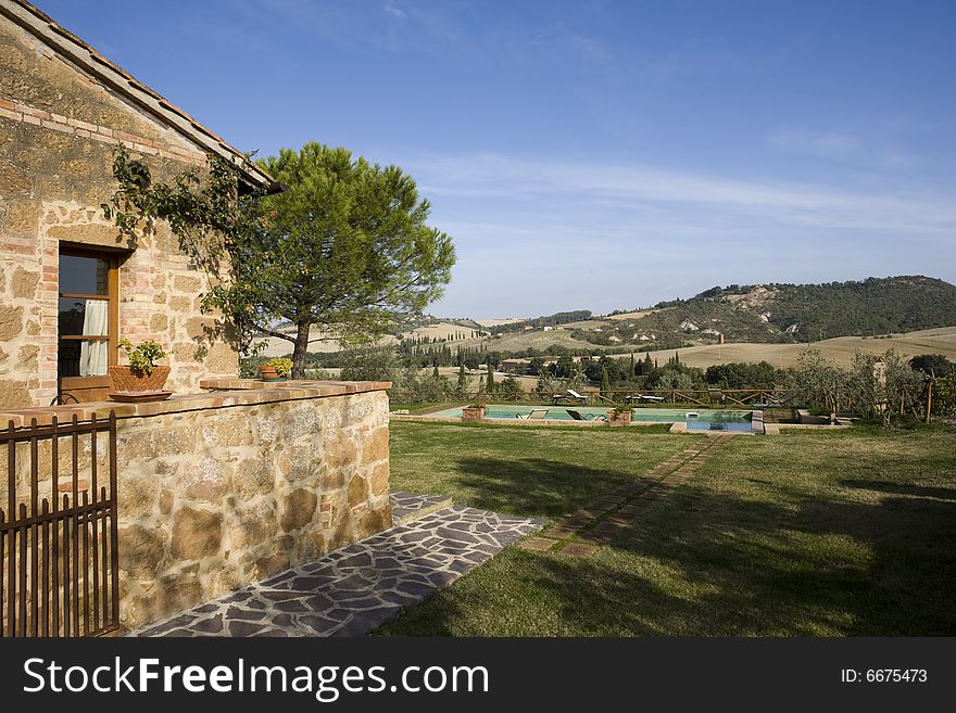 The garden of a luxury country house in the famous Tuscan hills, Italy. The garden of a luxury country house in the famous Tuscan hills, Italy.