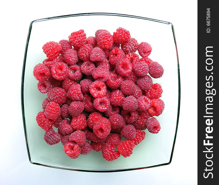 Red raspberry on white background, close up