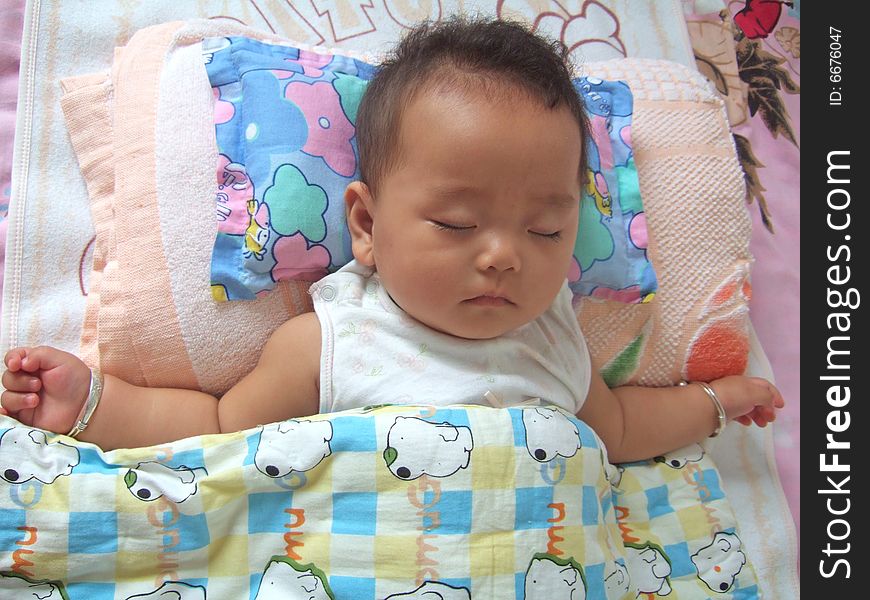 Sleeping Baby on a bed