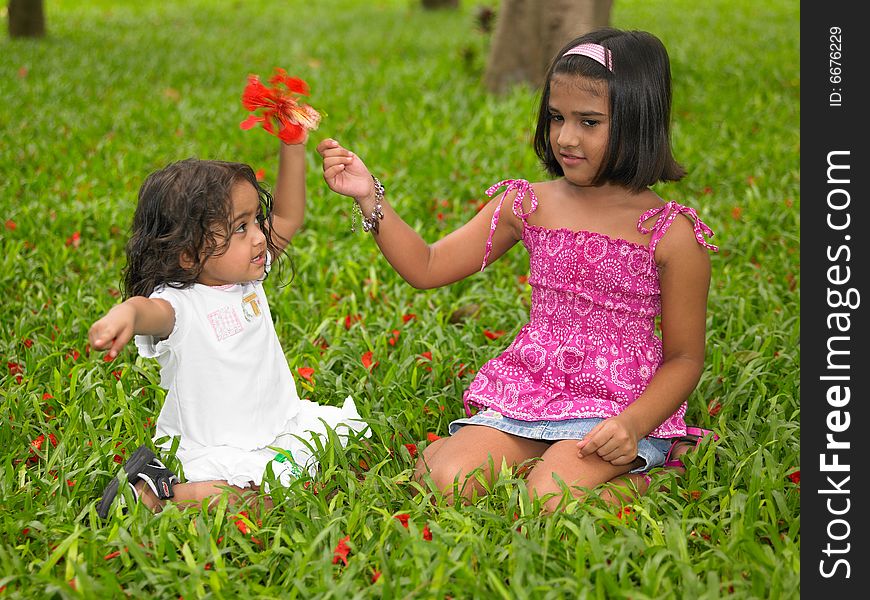 Two Asian Girls In A Garden