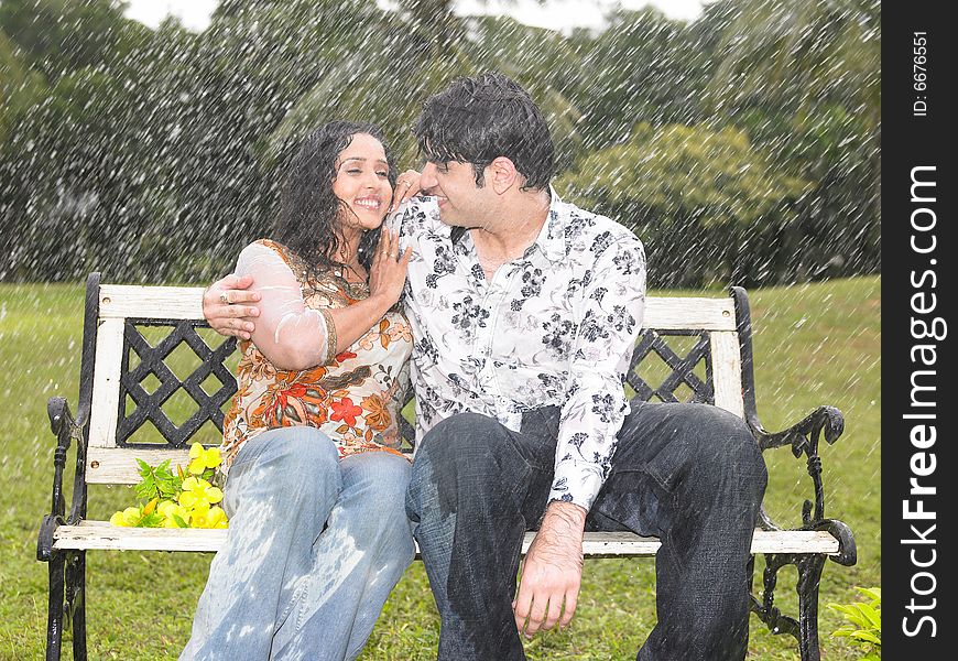 Asian couple of indian origin in the drizzle. Asian couple of indian origin in the drizzle