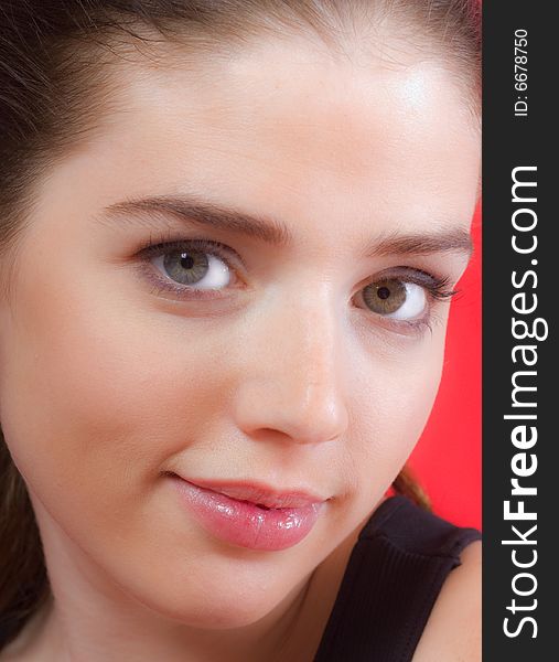 Close-up portrait of a beautiful young woman. Close-up portrait of a beautiful young woman