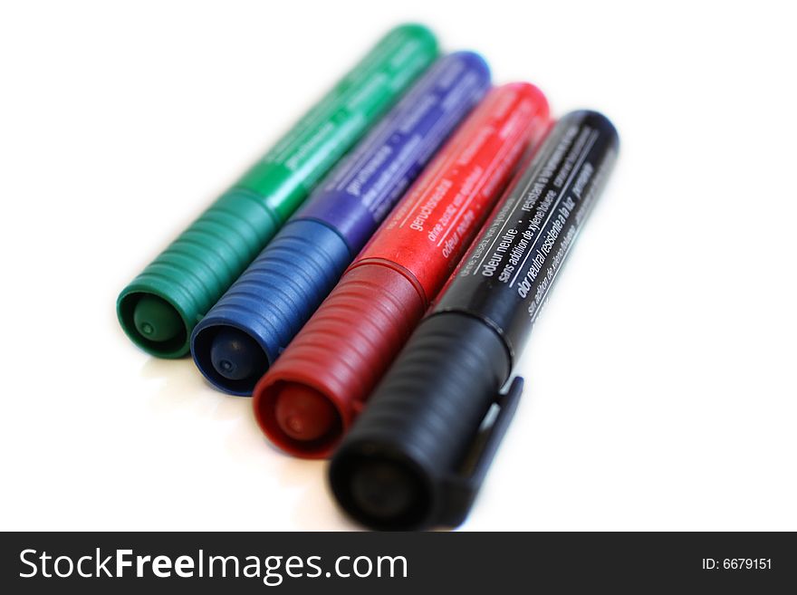 Office pen with different colors on white background
