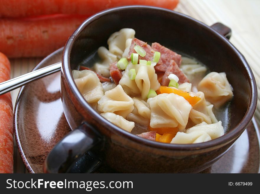 A soup of fresh tofu noodles with vegetables