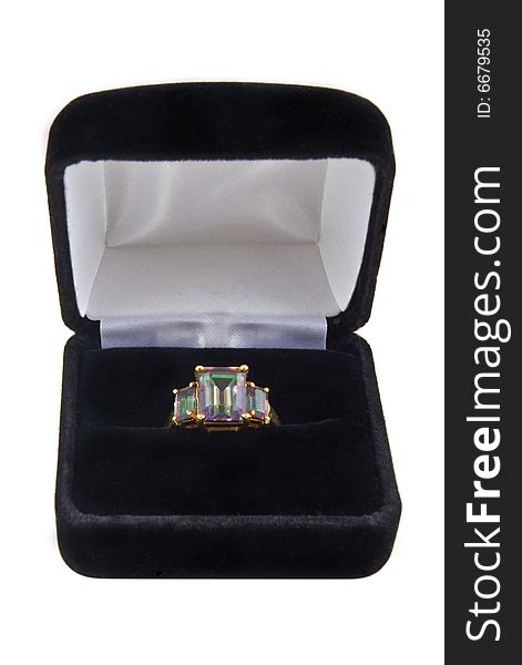 A mystic green topaz ring in a box