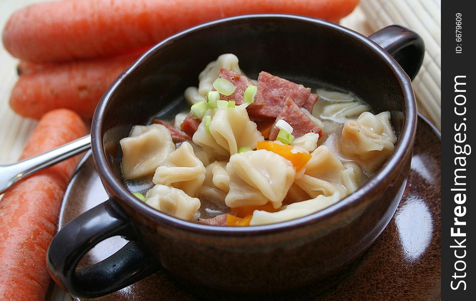 A soup of fresh tofu noodles with vegetables
