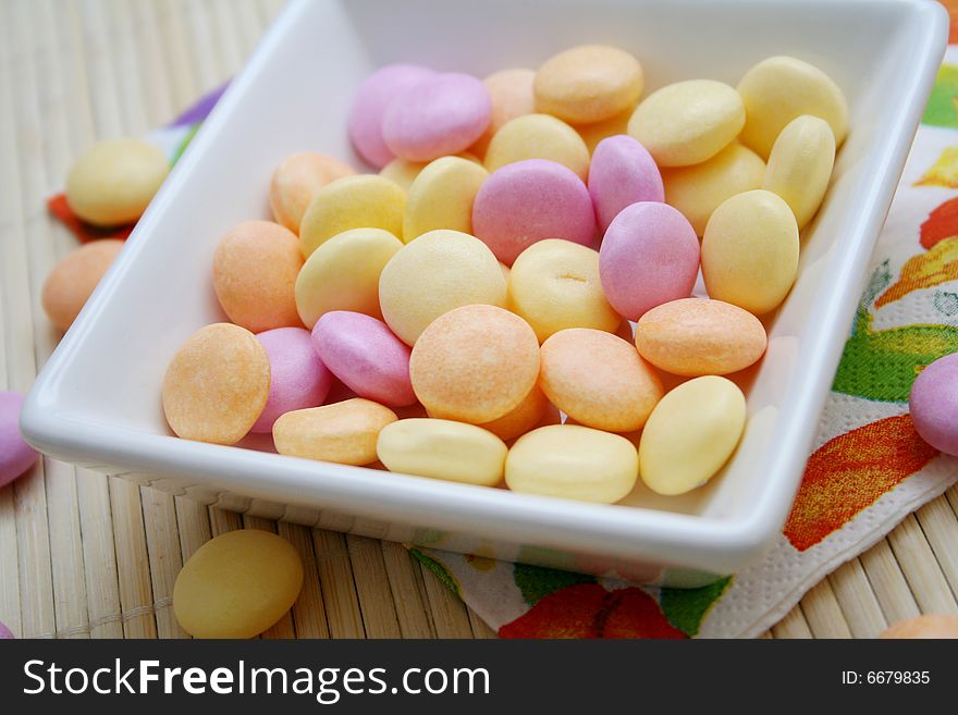 Some colourful sweet candies in a bowl