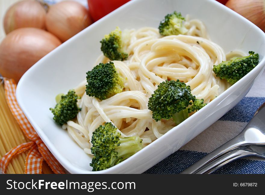 Italian noodles with cheese sauce and broccoli. Italian noodles with cheese sauce and broccoli