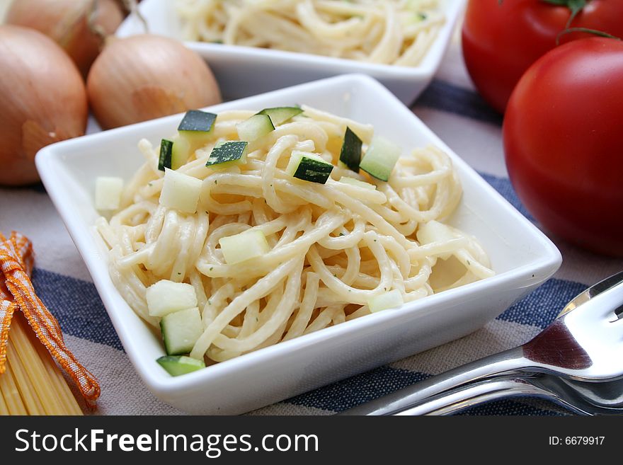 Italian noodles with cheese sauce and zucchini. Italian noodles with cheese sauce and zucchini