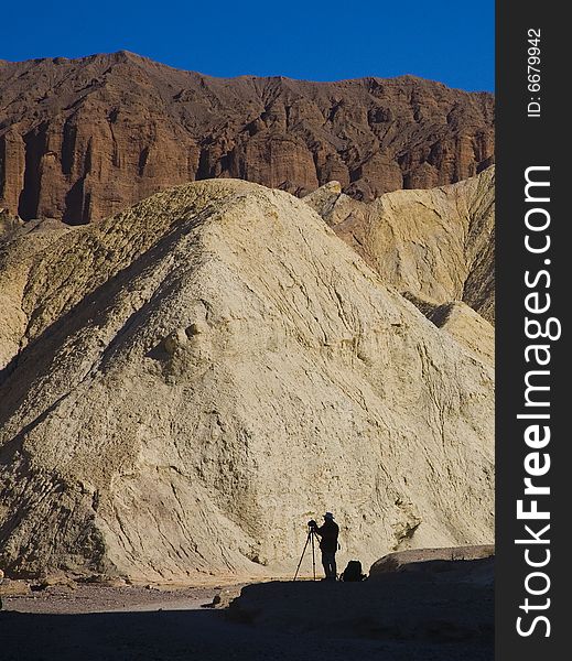 Shaddle of photographer in Death Valley mountains. Shaddle of photographer in Death Valley mountains
