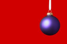 Purple Christmas Ornament On Red Background Stock Images