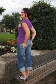 Girl Standing On Park Bench. Stock Photos Girl Standing On Park Bench. Stock Photos