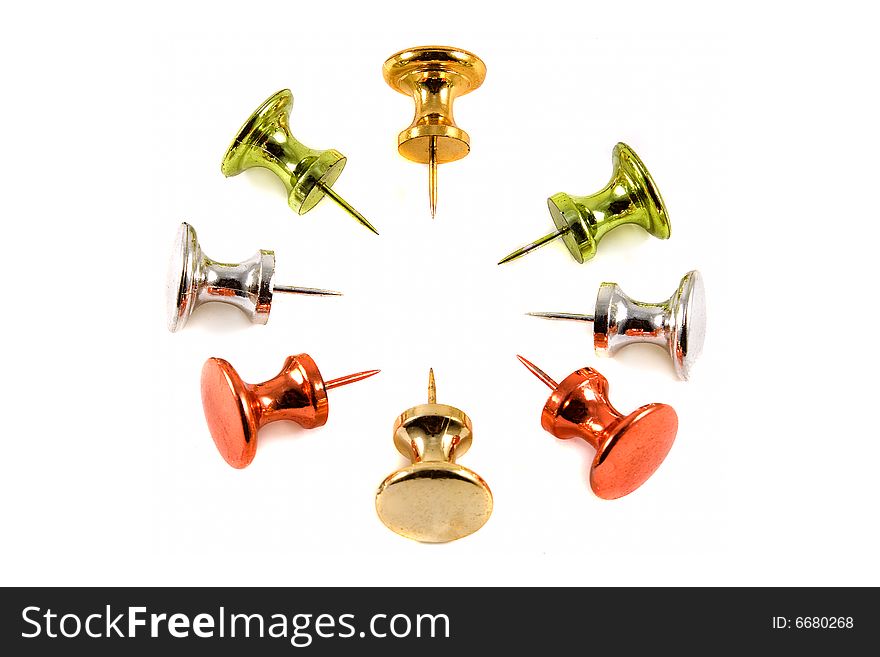 Colorful Metallic Push Pins on white background