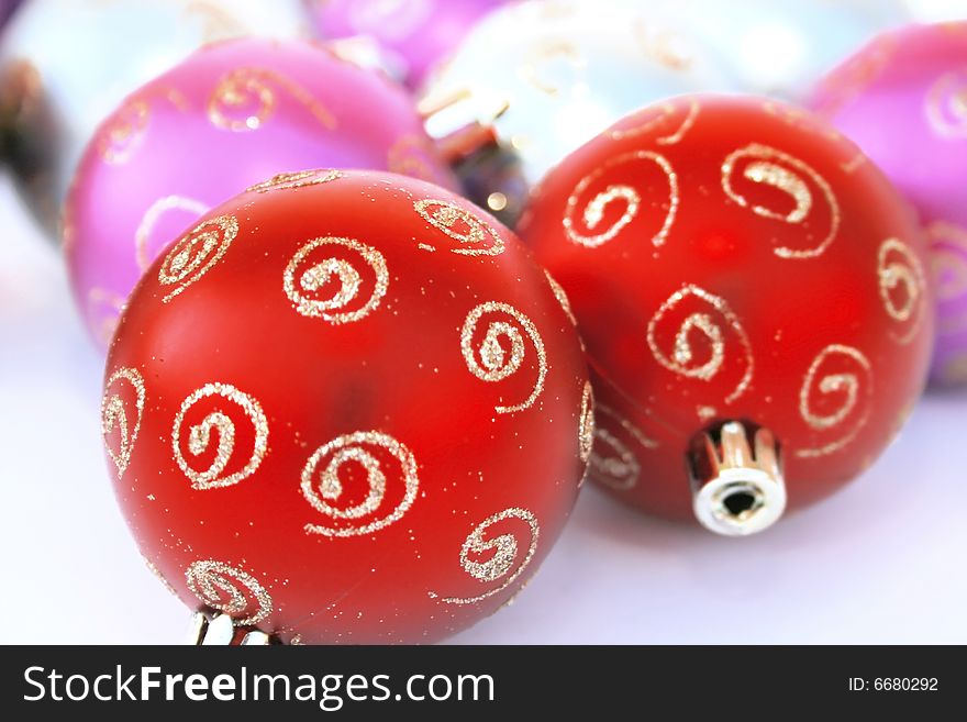 Christmas colorful balls.Focus on left red ball.