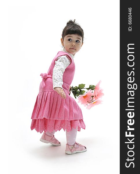 A beautiful little girl in pink dress