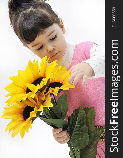 The little girl in pink dress with flowers