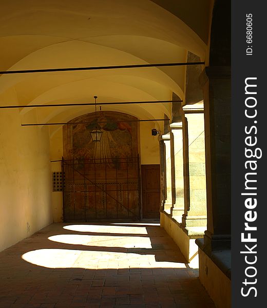 A wonderful shot of a porch in an ancient cloister with a suggestive play of light. A wonderful shot of a porch in an ancient cloister with a suggestive play of light