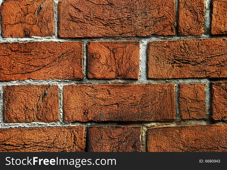 An old red brick wall background texture.