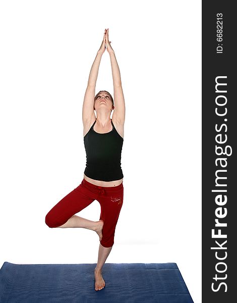 High key image of young woman in yoga pose