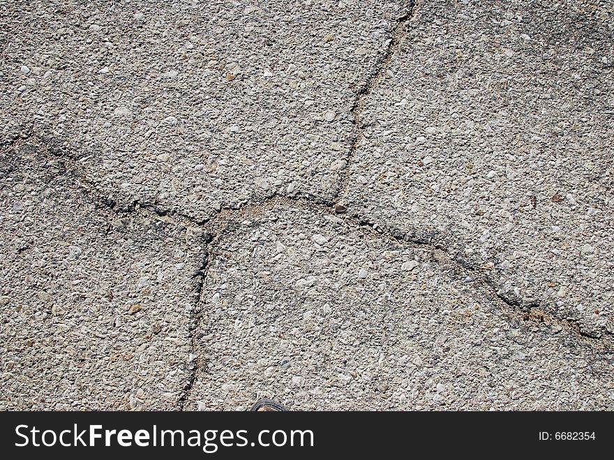 Fragment of old cracked asphalt road close up. Fragment of old cracked asphalt road close up