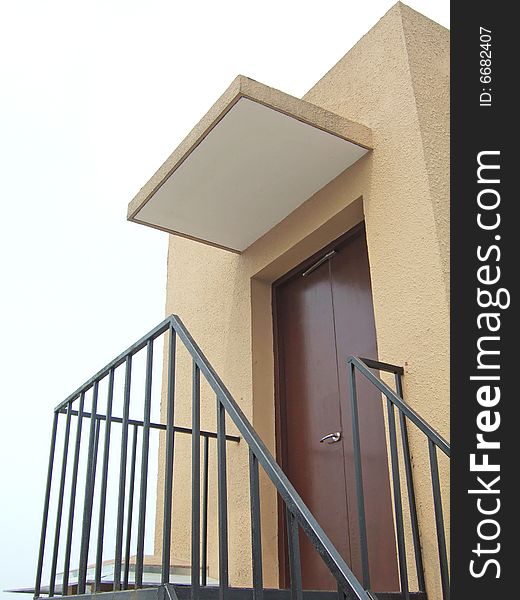 Railings and door under a balcony