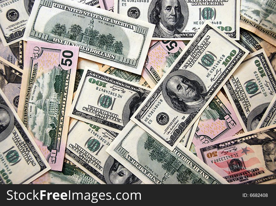 Money background of $100 and $50 bills in USA currency. Money background of $100 and $50 bills in USA currency