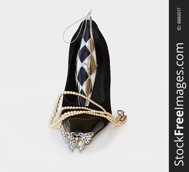 Sexy Christmas black stilettos with string of pearls and diamante butterfly. Clipping path included. Sexy Christmas black stilettos with string of pearls and diamante butterfly. Clipping path included.