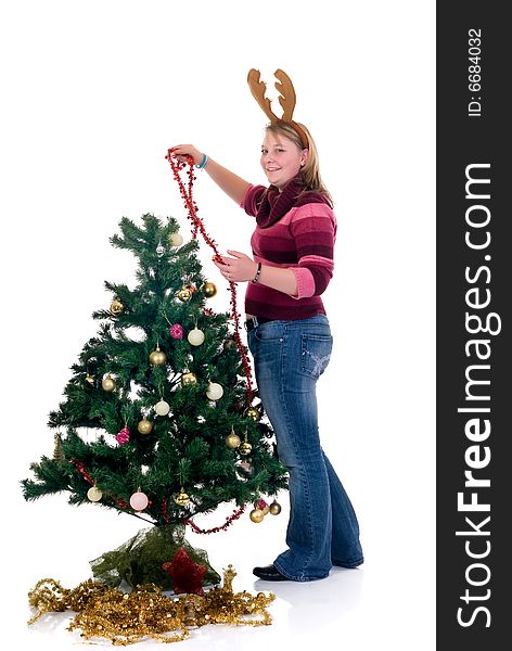 Happy girl decorating the Christmas tree on white background. Happy girl decorating the Christmas tree on white background