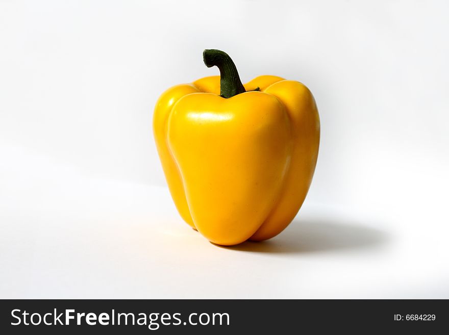 Yellow pepper on white background