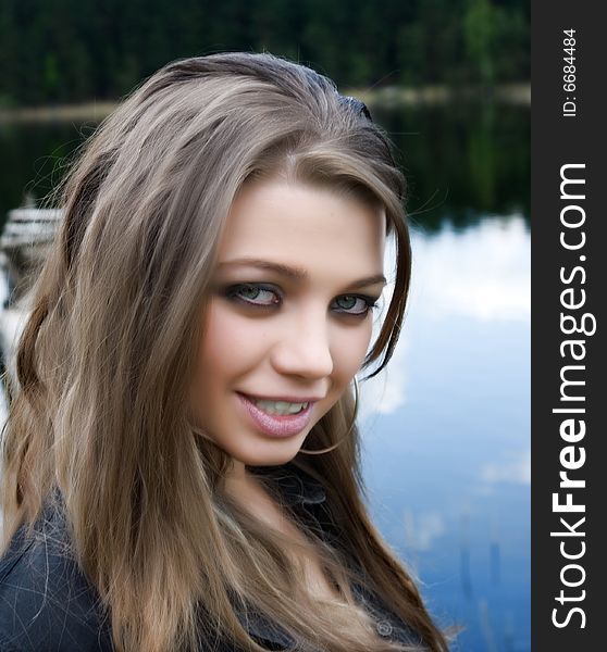 Portrait of young sexual girl on lake background