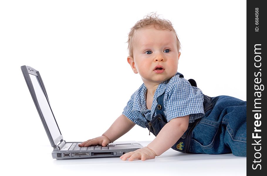 Baby with laptop on white