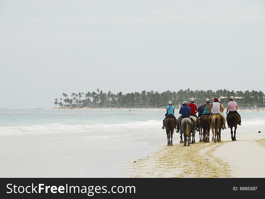 People were on horseback by the beautiful Macao beach in Punta Cana, Dominican Republic. People were on horseback by the beautiful Macao beach in Punta Cana, Dominican Republic
