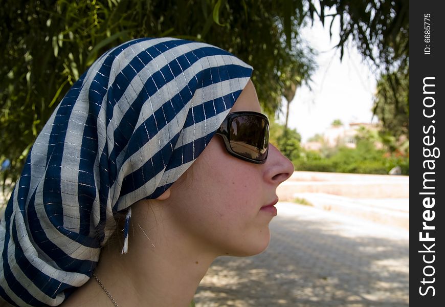 Women with scarf and glasses in the park, Marrakesh, Morocco. Women with scarf and glasses in the park, Marrakesh, Morocco