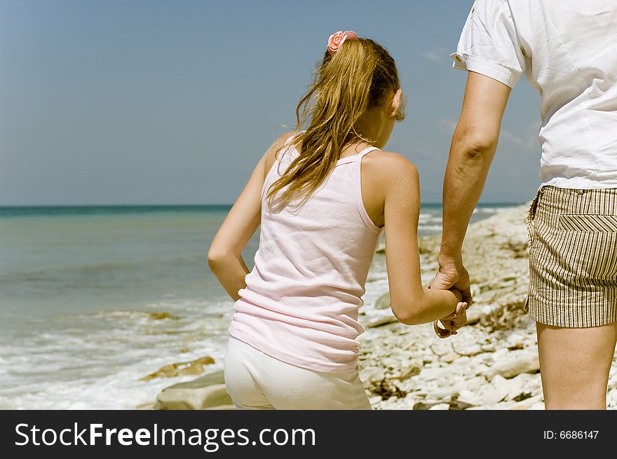 Father and daughter on the beach