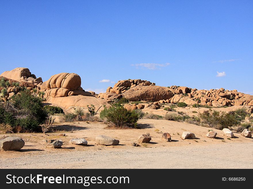 Red rock formation in the desert under a vivid blue sky