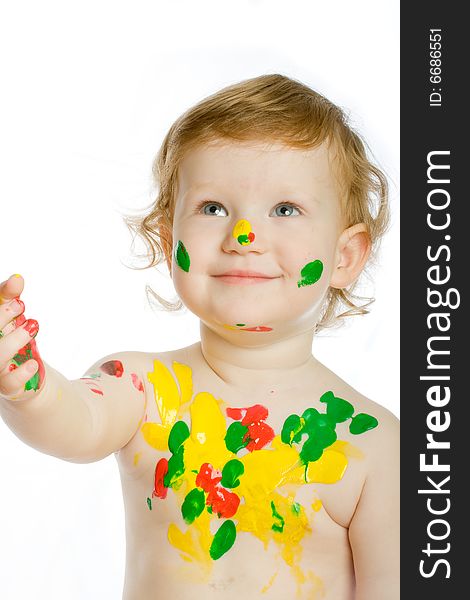 Little artist with many of paint spots on her body and face