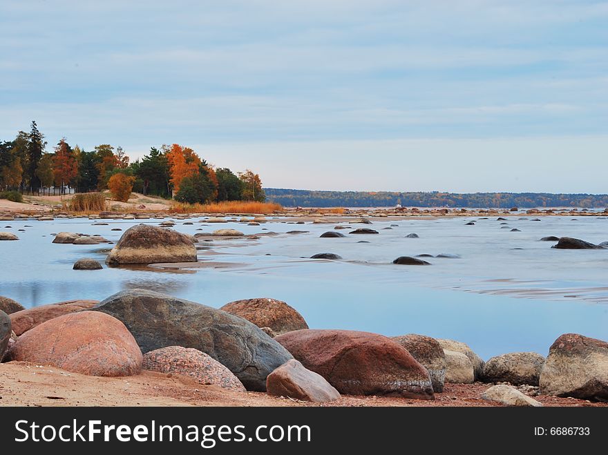 Finnish gulf shore in autumn with rocks and trees