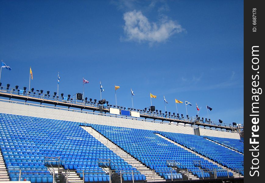 Blue stadium seats and flags