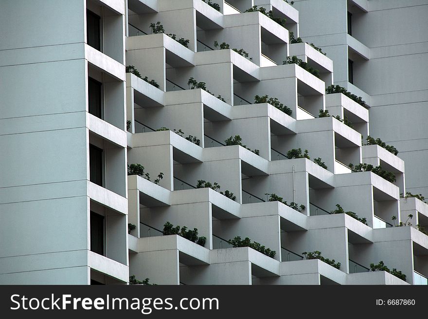 Each hotel balcony has a small garden. Each hotel balcony has a small garden.