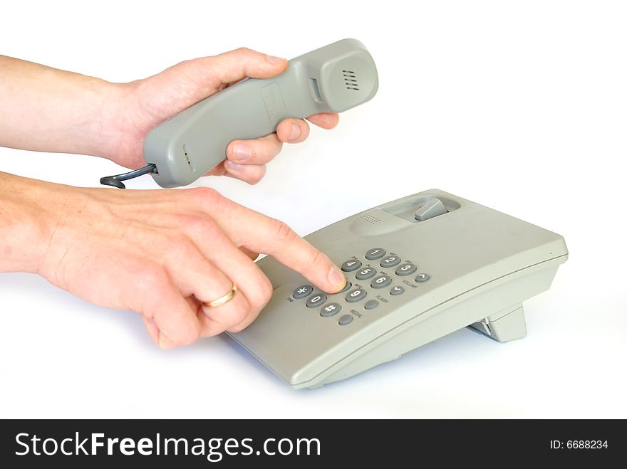 Finger presses figure on phone