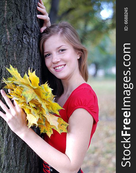 Beauty Woman With Yellow Leaves