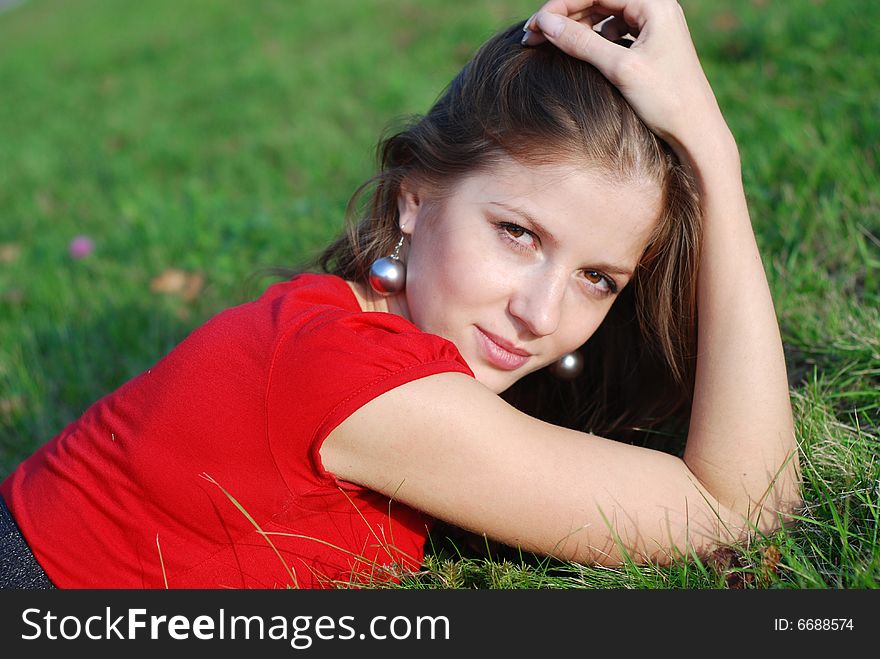 Young woman and green grass