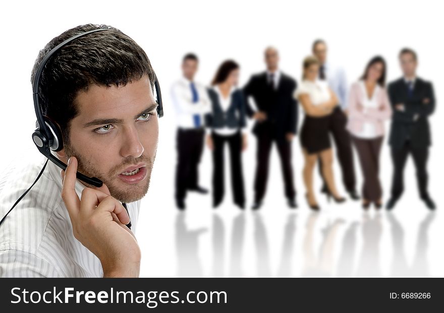 Businessman talking on headphone with businesspeople