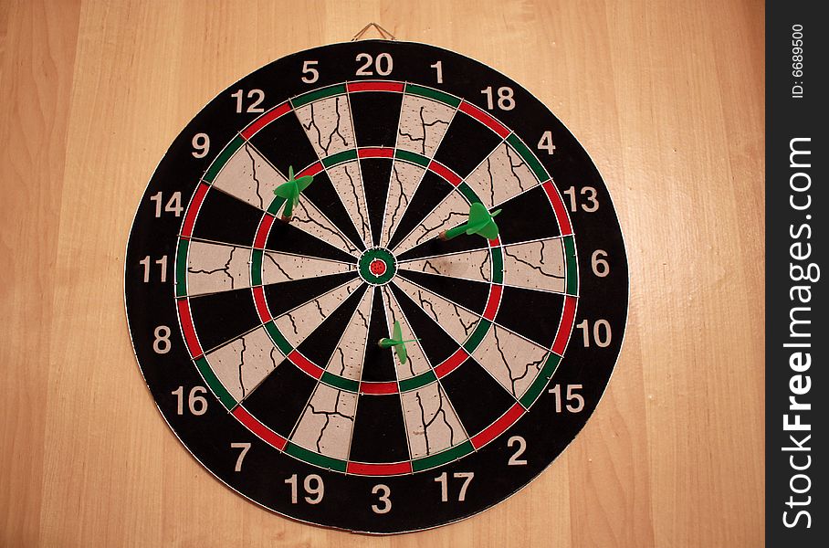Three darts in dartboard