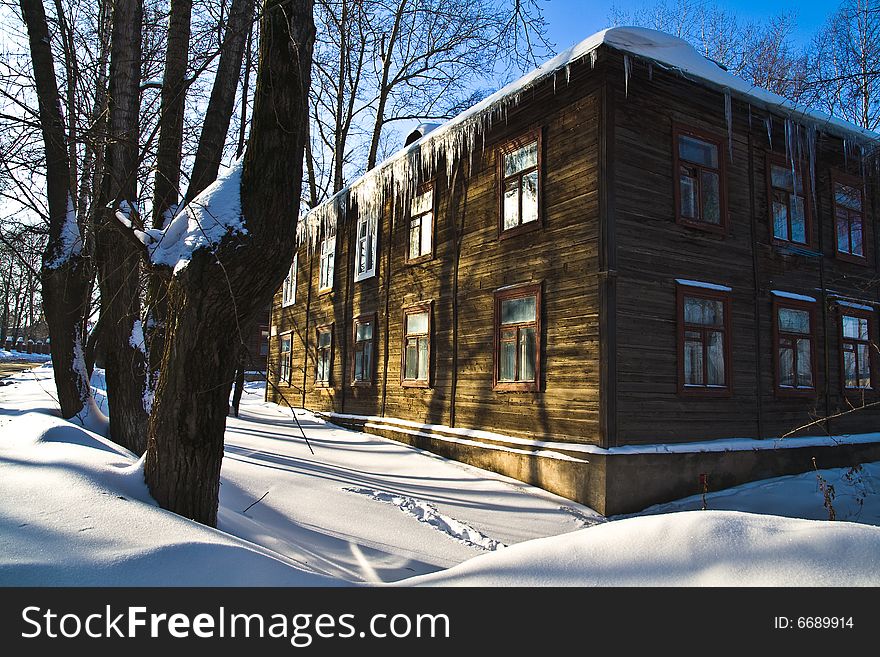 Wooden house in solar winter day. Wooden house in solar winter day