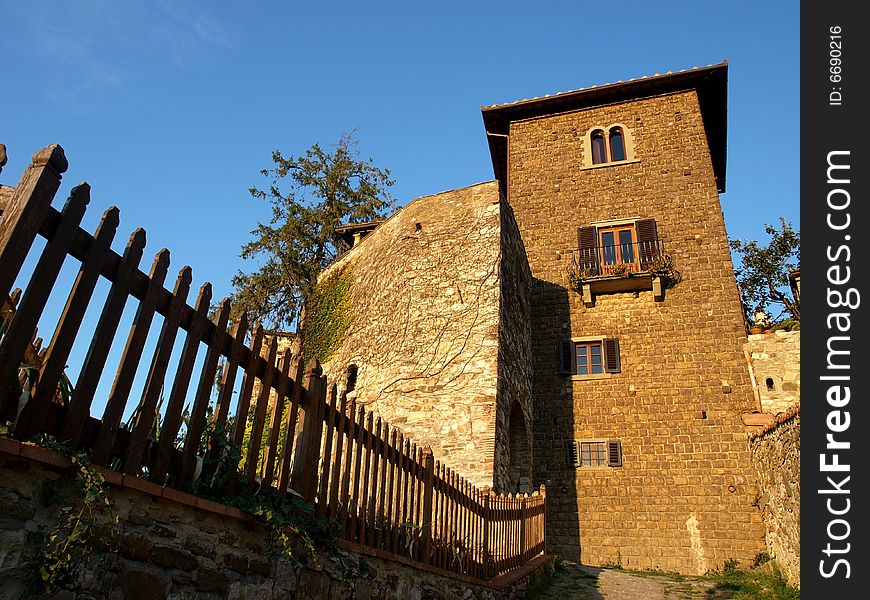 A wonderful glimpse of a fench and an old house in Florence countryside. A wonderful glimpse of a fench and an old house in Florence countryside