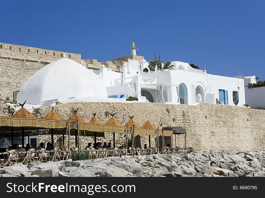 White arabic medina over old wall. White arabic medina over old wall