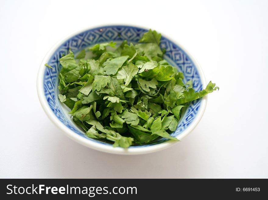 Some fresh asian coriander green in a bowl